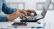 © Abuzar - Business professional using calculator and laptop for budget planning, tax calculation and financial analysis, concept of accounting management and cash flow control.