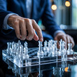 © Nimra - 'Executive Strategic Play: Hands Moving Glass Chess Pieces on Reflective Board Symbolizing Corporate Strategy, Leadership Decisions and Competitive Tactics'