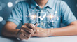 © Mahadi - Man holding magnifying glass over glowing checkmark, symbolizing quality assurance, data verification, and efficient digital process analysis in business management