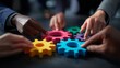 © Busayo - Teamwork of business people working together and combining pieces of a gear puzzle, business team work, business people working together, business people holding gear