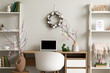 © Pixel-Shot - Interior of office decorated for Easter with workplace and shelf units