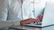 © peopleimages.com - Laptop, research and hands with business person in office for typing, account report and review. Planning, portfolio update and online budget email with employee in agency for investor proposal