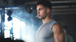 © peopleimages.com - Breathing, fitness and thinking with man in gym for bodybuilding, strength or training results. Exercise, smoke and vision with confident bodybuilder in health club for commitment or dedication