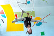 © Ольга Симонова - Young girl in black sportswear practicing aerial hoop movements, acrobatic technique, safety, elastic bandage for comfort.
