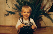 © XArt - Little boy holding vintage film camera, authentic 1990s family snapshot, retro childhood photography