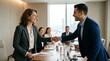 © Saeed - Professional business man and woman shaking hands in a modern conference room symbolizing a successful partnership agreement and corporate collaboration