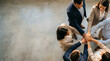 © alex - Diverse business team stacking hands in a powerful display of unity and collaboration for shared success and professional partnership