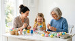 © Ahmed - Multi generational family easter egg decorating activity spring celebration