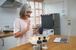 © Tanison - Senior Woman Learning to Cook (Healthy Lifestyle)