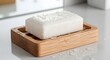 © CG - Beechwood soap dish holding rectangular bar with water droplets minimalist clean bathroom accessory