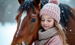 © Viktor - Young girl embraces brown horse in snowy winter landscape. Child wears pink hat and scarf, feeling warmth and love with equine friend outdoors. Gentle snow falls on them.