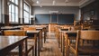 © pedro - Empty Classroom with Wooden Desks and Chalkboard.