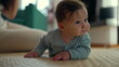 © Marco - Baby lying on mat indoors, lifting head with curious expression, engaged in early movement, developing strength and coordination, peaceful home setting, milestone growth
