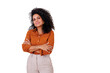 © Komora - Smiling woman with crossed arms showing confidence and positive attitude, standing against a transparent background