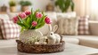 © Honey - A beautifully decorated Easter basket with pink tulips and a white rabbit on a coffee table in a cozy living room