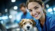 © keks20034 - Female vet in blue scrubs holding cheerful dog in bright animal clinic