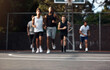 © peopleimages.com - Basketball, sports and men running on court for warm up, exercise and training for practice. Athlete, friends and people with drills for fitness, health and workout for hobby, game and tournament