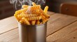 © IMOTIONart - Golden Crinkle Cut French Fries Steaming In Metal Container On Rustic Wooden Table