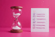 © photoshop #11320770 - Hourglass with checklist on pink background, symbolizing time management