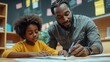 © Sabbir Dzns - A man helping a young girl with her schoolwork at a desk in a classroom