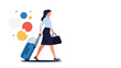 © Michael - Confident businesswoman walks purposefully while pulling a blue suitcase and carrying a black handbag for her business trip.