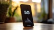 © Muhammad - Modern smartphone showcasing the advanced 5G network technology with a digital waveform on its screen, representing fast and reliable future connectivity for mobile devices.