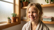 © Rohan Katwe - Young girl laughs while applying face cream in a sunlit bathroom, heart-shaped lotion on her cheek conveying playful self-care, confidence and morning skincare routine at home.