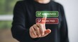 © Md - A person interacting with virtual approved and rejected buttons