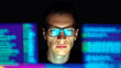 © Dreamdecko - Focused programmer coding on computer with glowing screens in dark workspace software development cybersecurity technology concept