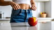 © Haseeb - Apple in front of slim female body healthy diet nutrition and weight loss concept