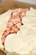 © ffolas - Arrange puff pastry rounds on top of filling. Making Salmon in Puff Pastry Series.