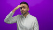 © Krakenimages.com - Hispanic man in white shirt expressing surprise against a vibrant purple background in various poses.