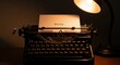 © SashaMagic - Vintage typewriter with paper under warm desk lamp lighting