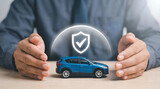Car insurance protection concept with hands shielding blue toy SUV and digital shield checkmark icon, vehicle safety coverage, auto insurance approval and protection service on wooden desk