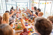 © Rawpixel.com - Joyful gathering with shared meal.