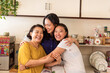 © Rawpixel.com - Joyful family kitchen embrace
