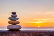 © Colin & Linda McKie - Cairn, outdoors in front of a sunrise.