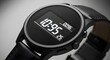 © Ahmad - A sophisticated close-up features a round black digital watch with a leather strap