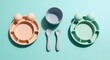 © Wildan - Colorful Frog-Shaped Baby Feeding Set with Plates, Bowl, Spoon, and Fork on a Turquoise Surface.