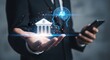 © Shabul - Businessman holding hand with bank and A I symbols on smartphone suit