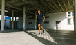 © ADDICTIVE STOCK - Young man jogging in urban setting for active lifestyle
