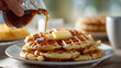 © Sky Layer - close-up of hand pouring maple syrup