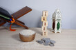 © PANCASONA CREATION - The background concept of Zakat: Rice on a wooden bowl, prayer beads, a remembrance, and scattered coins. Zakat is a form of obligatory charity in Islam. The concept of Islamic donation, or Zakat.