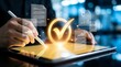 © Tabinda - A person using a digital tablet with a glowing checkmark and documents icons floating above the screen in a modern office setting.