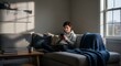 © Miu Studio - Young man relaxing on a couch while using his smartphone in a sunlit living room