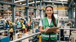 © Vasiliy - Smiling female factory worker holding a clipboard in a manufacturing plant. Young woman in green safety vest and glasses working as an industrial supervisor or quality inspector