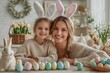 © Ranazain - A loving mother and her adorable daughter with bright smiles wear cute bunny ear headbands while celebrating Easter in their beautifully decorated home The scene is bathed in warm soft light creating
