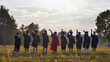 © Довидович Михаил - Students in graduation attire saying farewell at sunset, marking the completion of their educational voyage