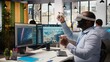 © DC Studio - Worker uses VR headset to optimize electrical grid and wind farm layout, enhancing clean energy systems. Technician does virtual reality simulation of power lines and futuristic wind turbine, camera A