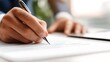 © StockBlend - Close-up of person signing business contract with pen